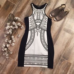 Black tight dress with white panel down the front.